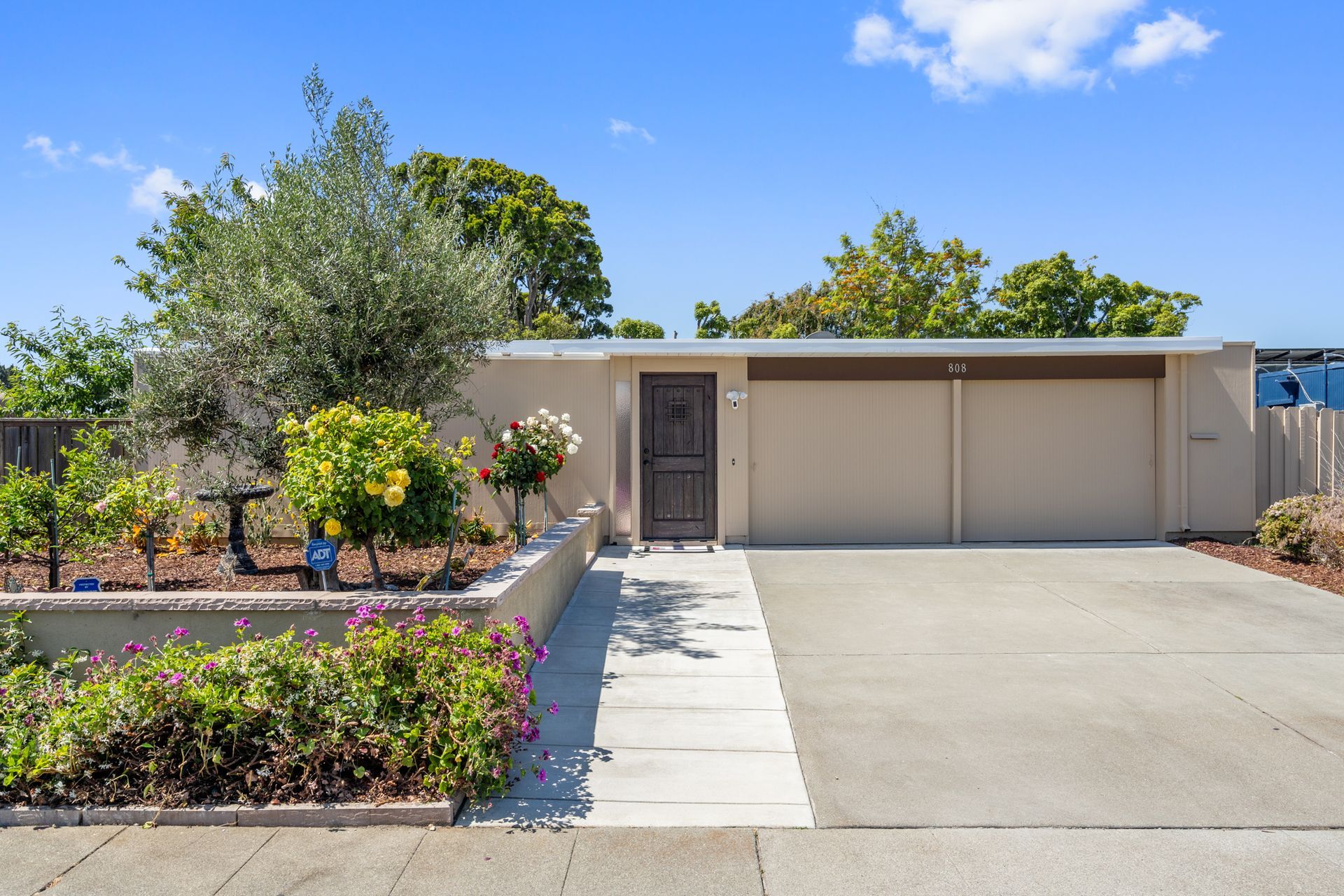 The front of a house with a driveway and a garage