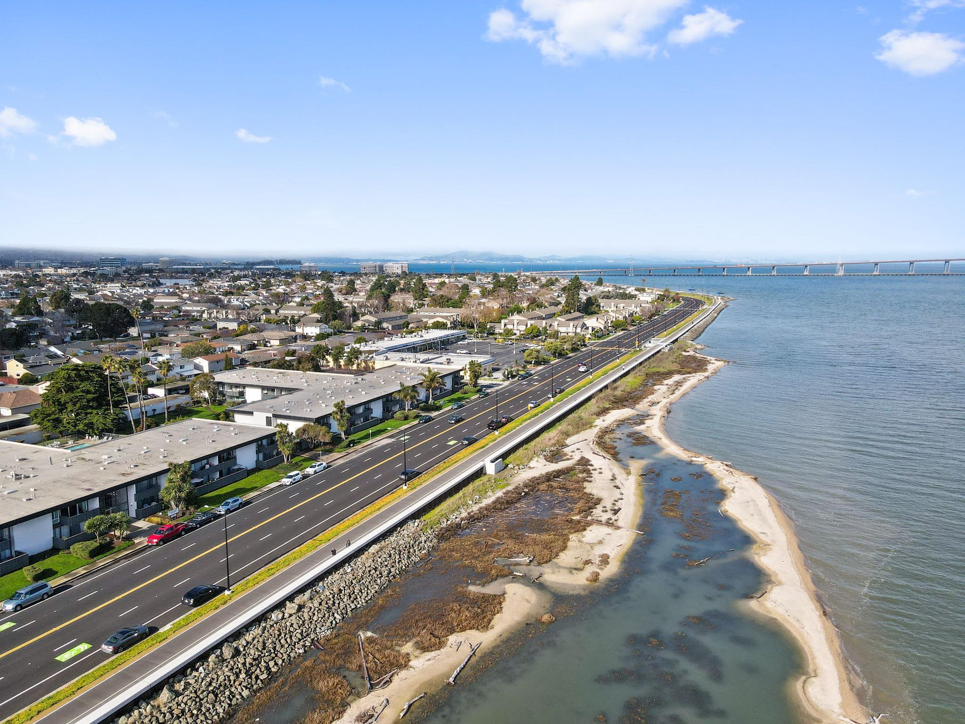 An aerial view of a city next to a body of water.
