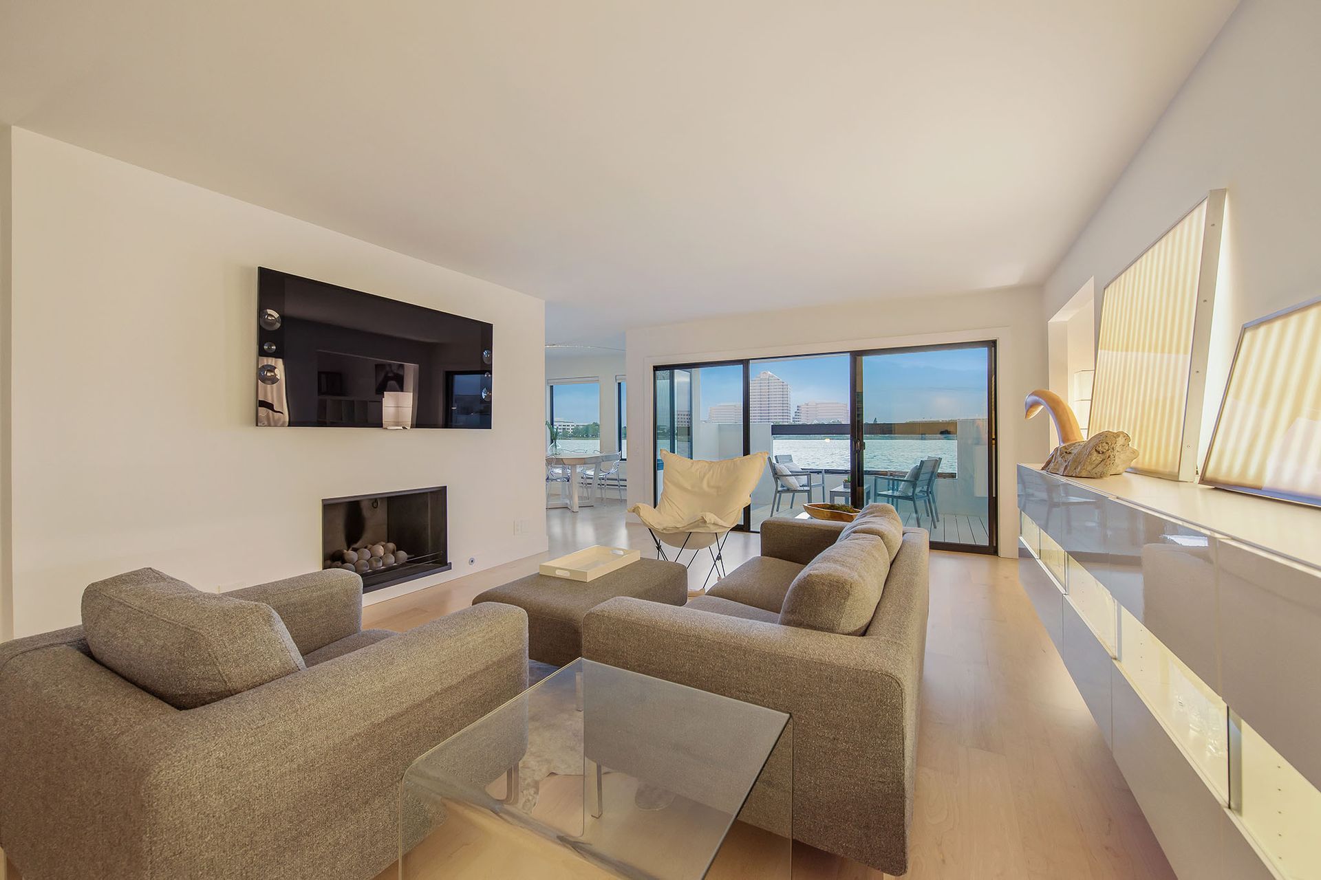 A living room with a couch and chairs and a fireplace