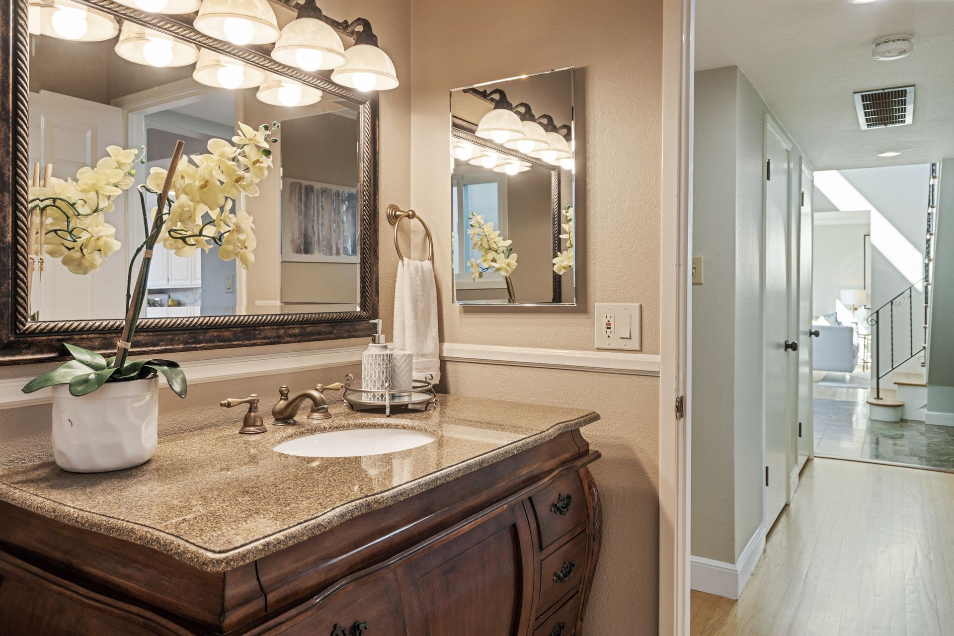 A bathroom with a sink and a mirror