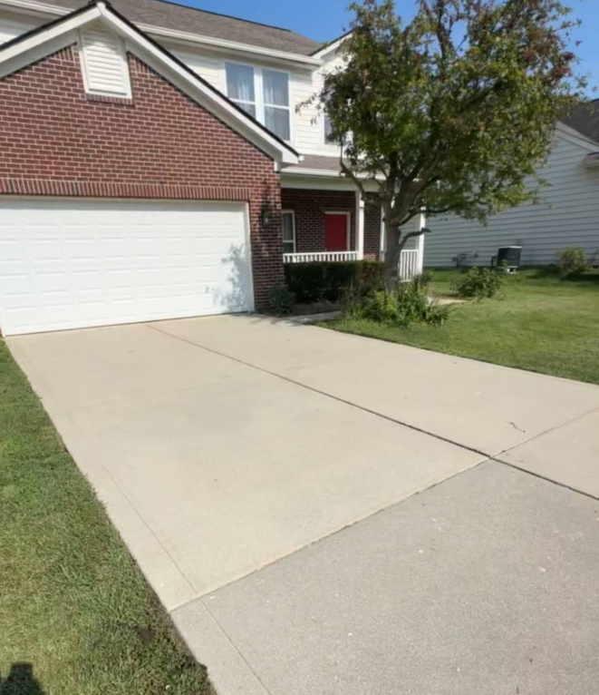 Concrete patio beside a covered pool, with a house and backyard in bright sunlight.