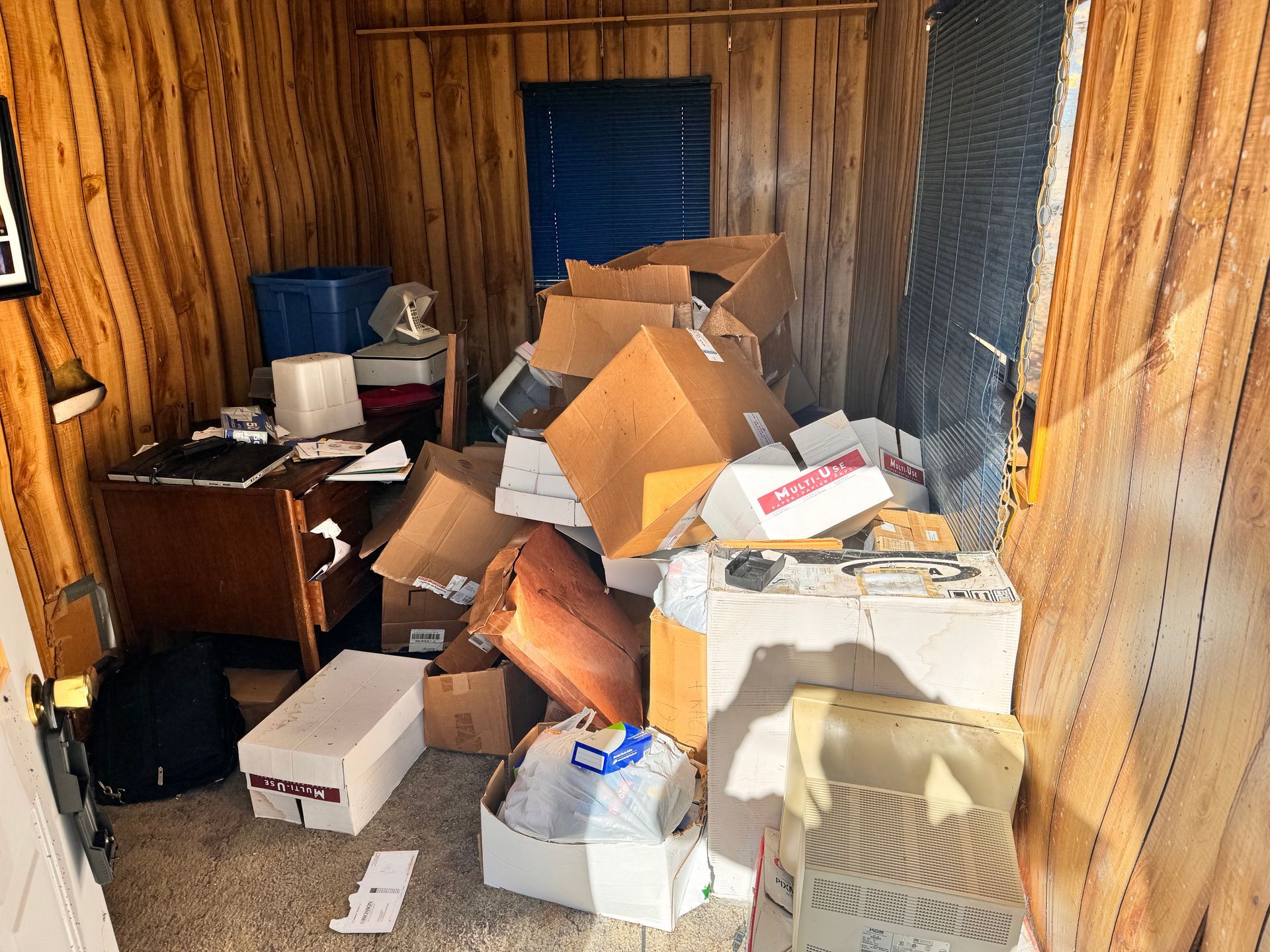 A room with a lot of boxes on the floor