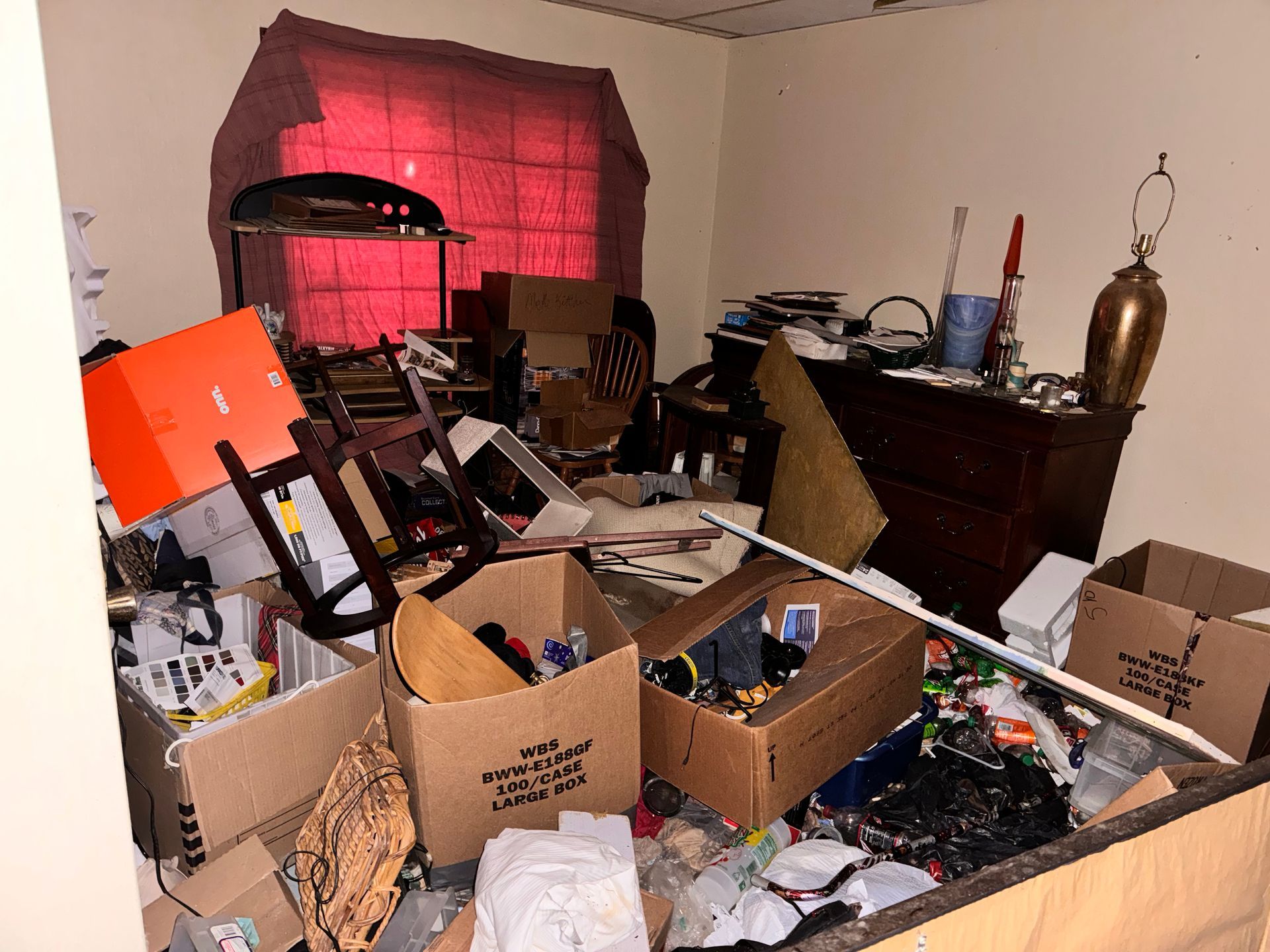 A room with a lot of boxes on the floor