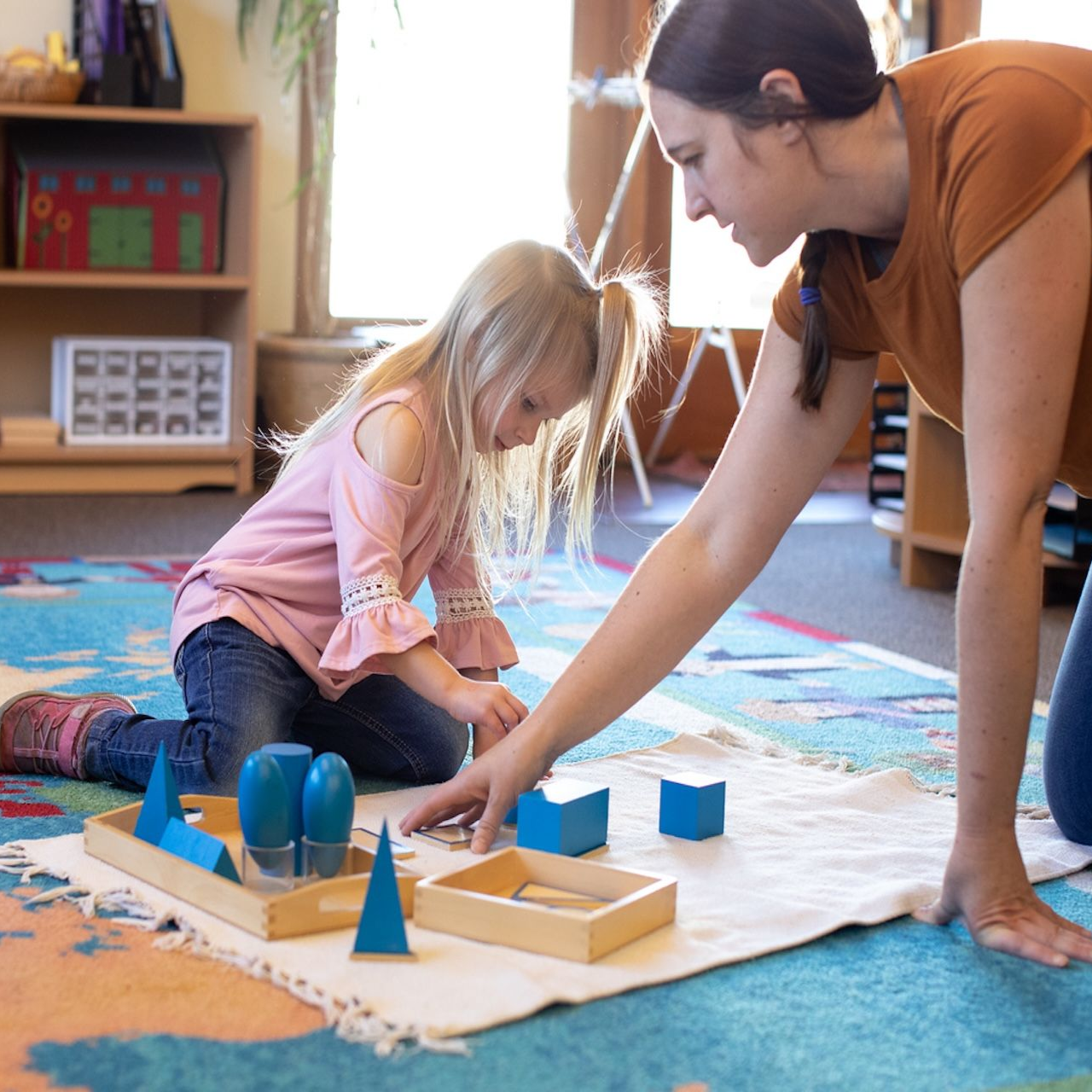 montessori child and teacher
