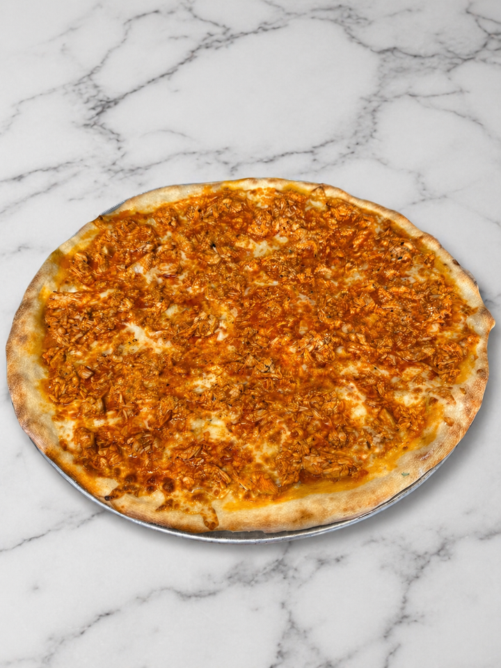 Round cheese pizza on a marble countertop