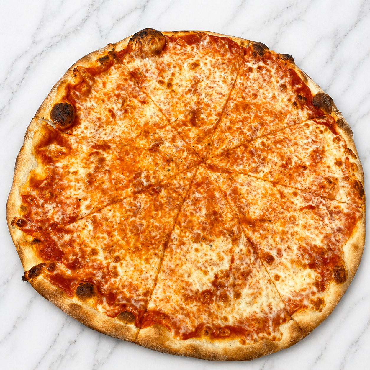 A plain cheese pizza with a golden-brown crust on a light marble surface