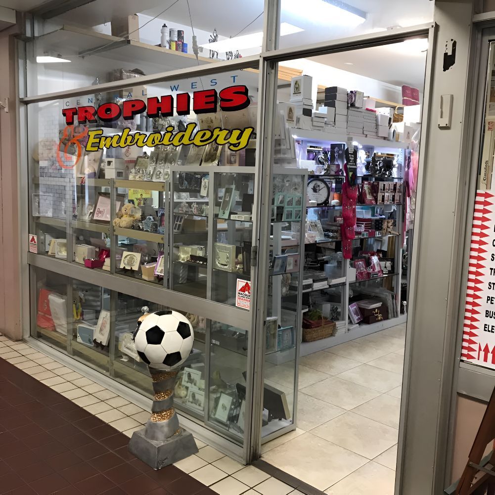 A Store Front With Trophies Embroidery Written on It — Central West Trophies & Embroidery In Orange, NSW