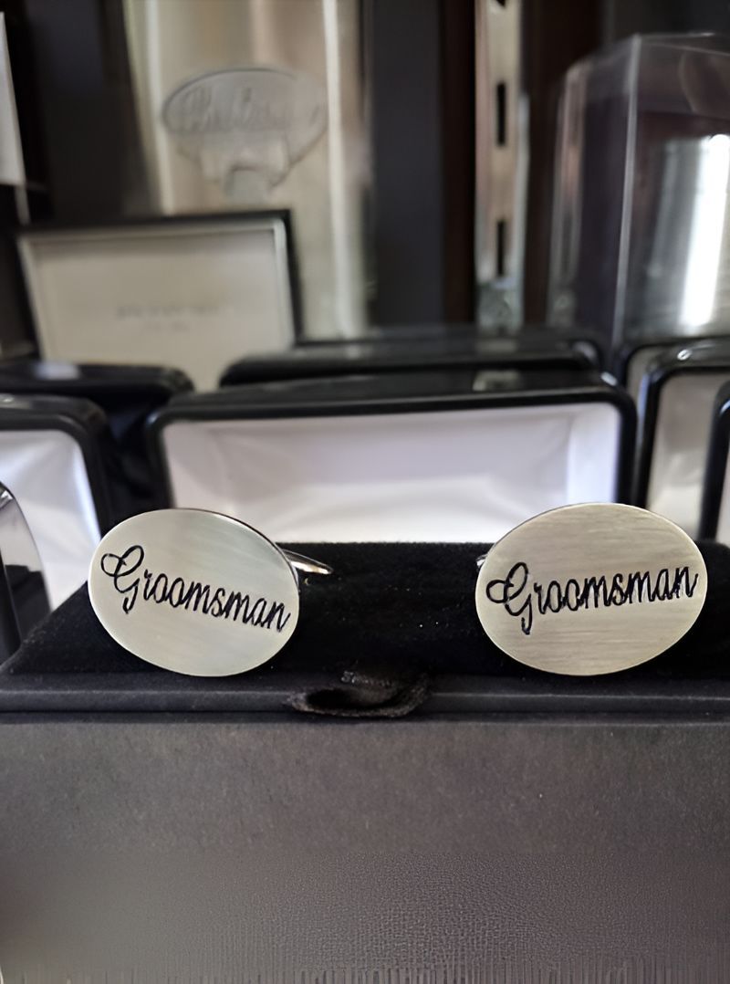 A Pair of Groomsman Cufflinks Are Sitting in a Box — Central West Trophies & Embroidery In Orange, NSW