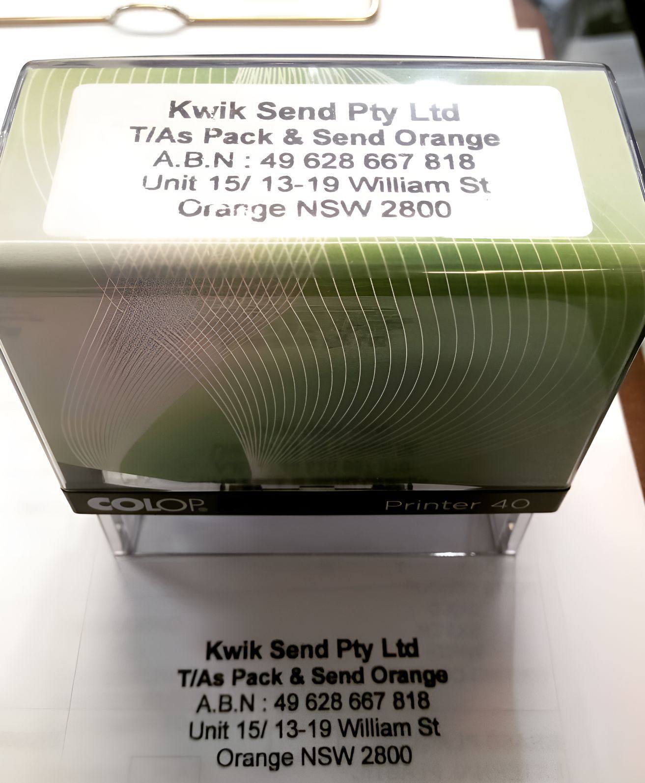 A Kwik Send Pty Ltd Stamp Sits on a White Surface — Central West Trophies & Embroidery In Orange, NSW