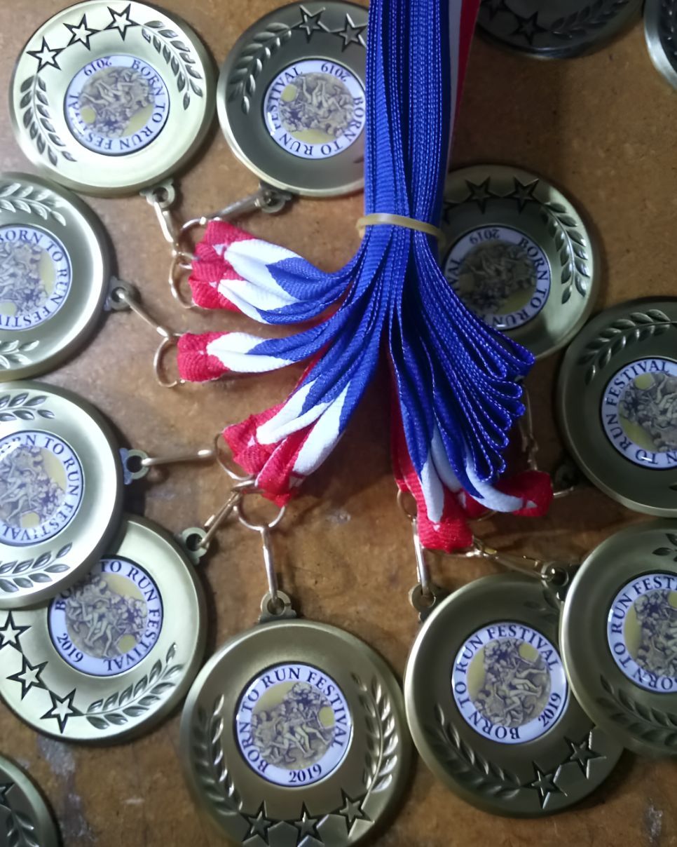 A Bunch of Medals With the Word Run on Them — Central West Trophies & Embroidery In Orange, NSW