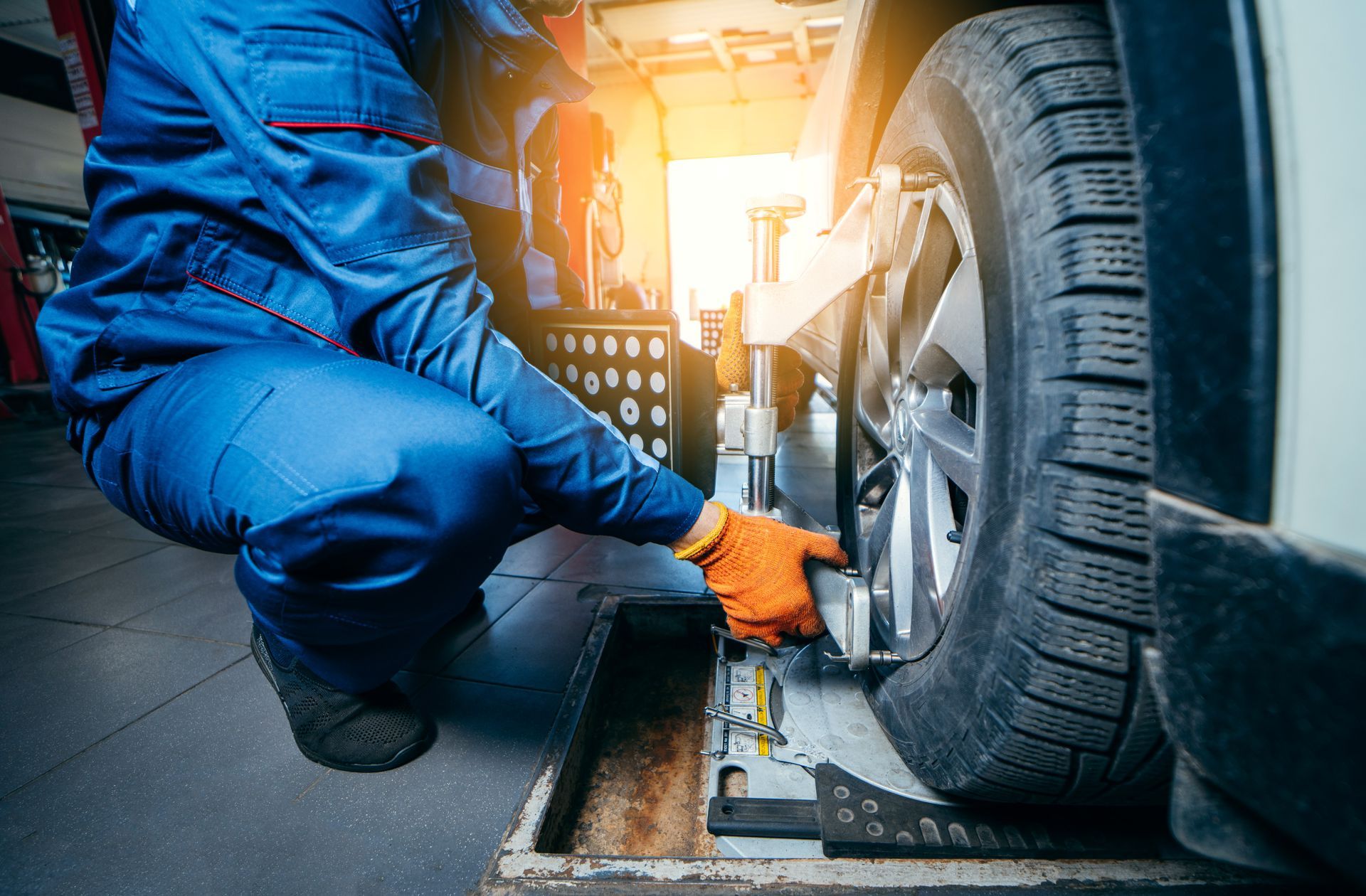 Mechanic aligning the wheels | Central Auto Works