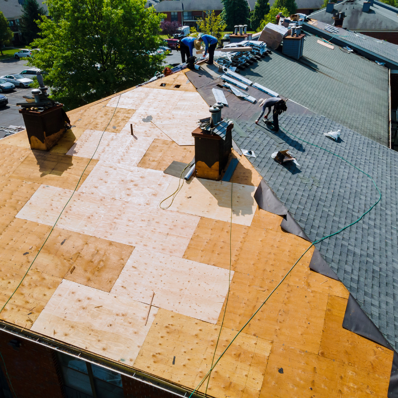 An aerial view of a roof that is being repaired