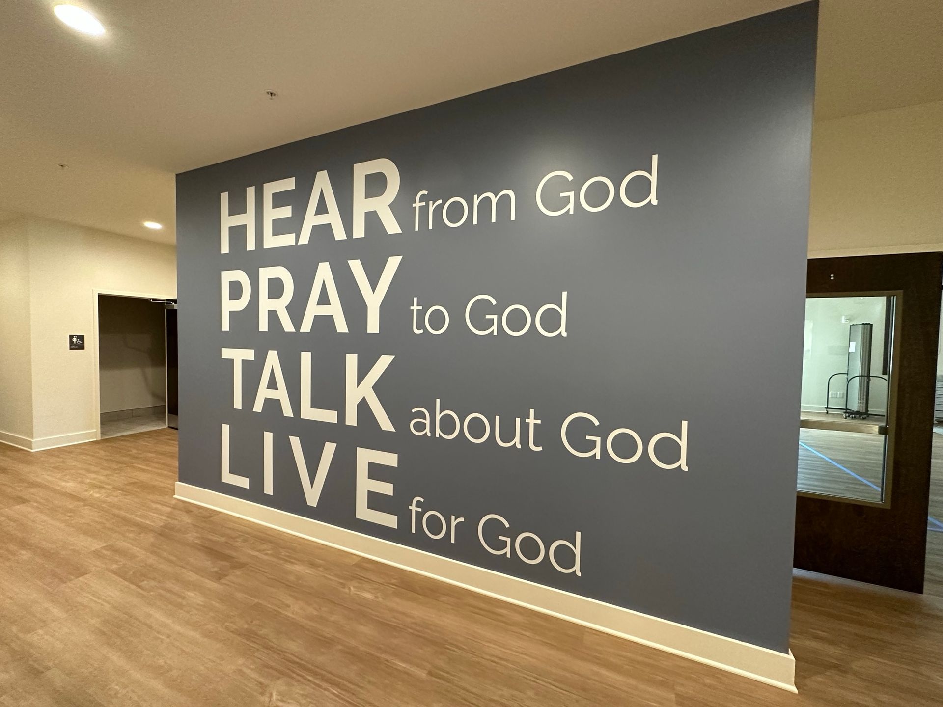 A wall that says hear from god pray to god talk about god live for god