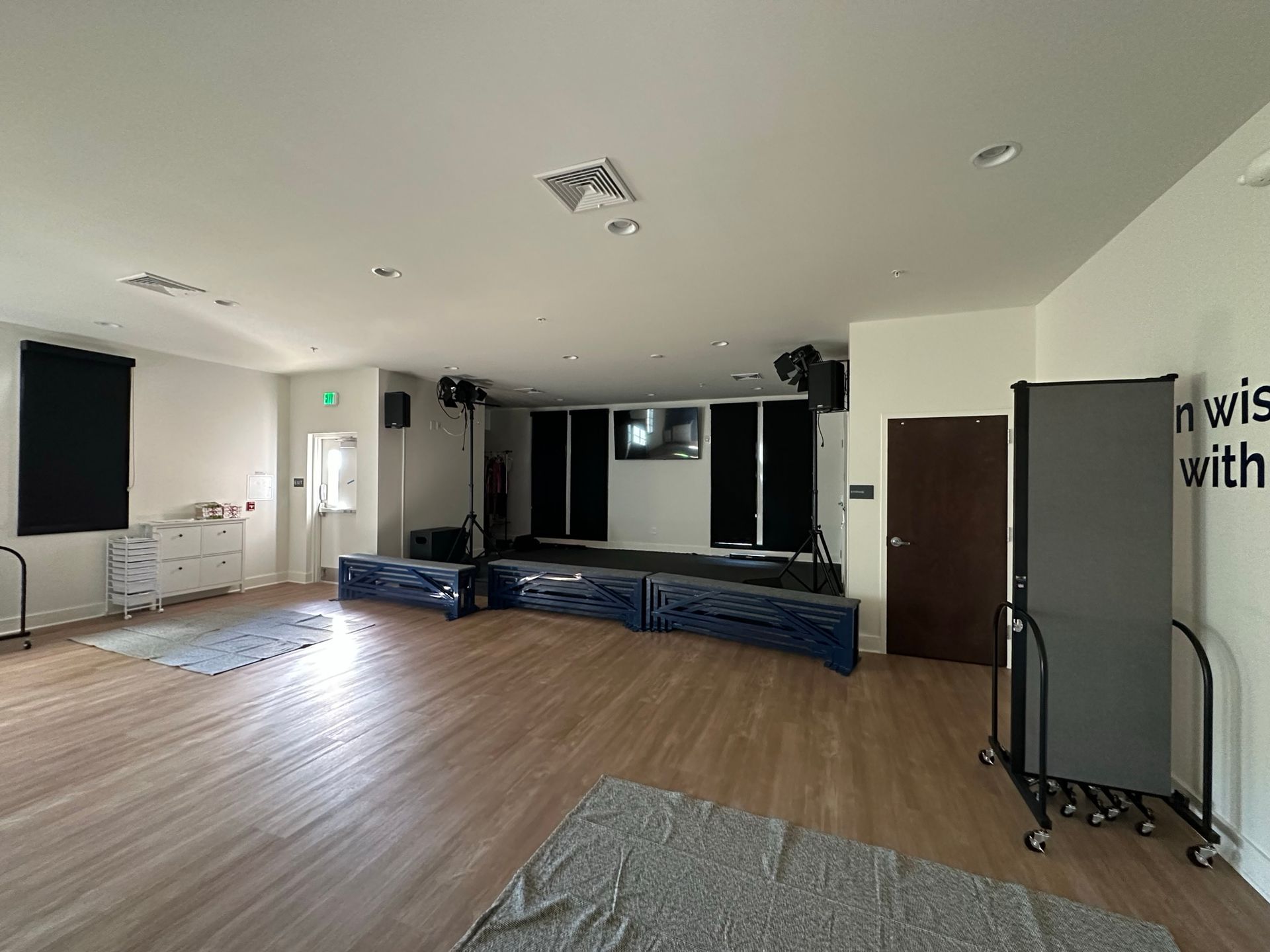 An empty room with a sign on the wall that says i wish with