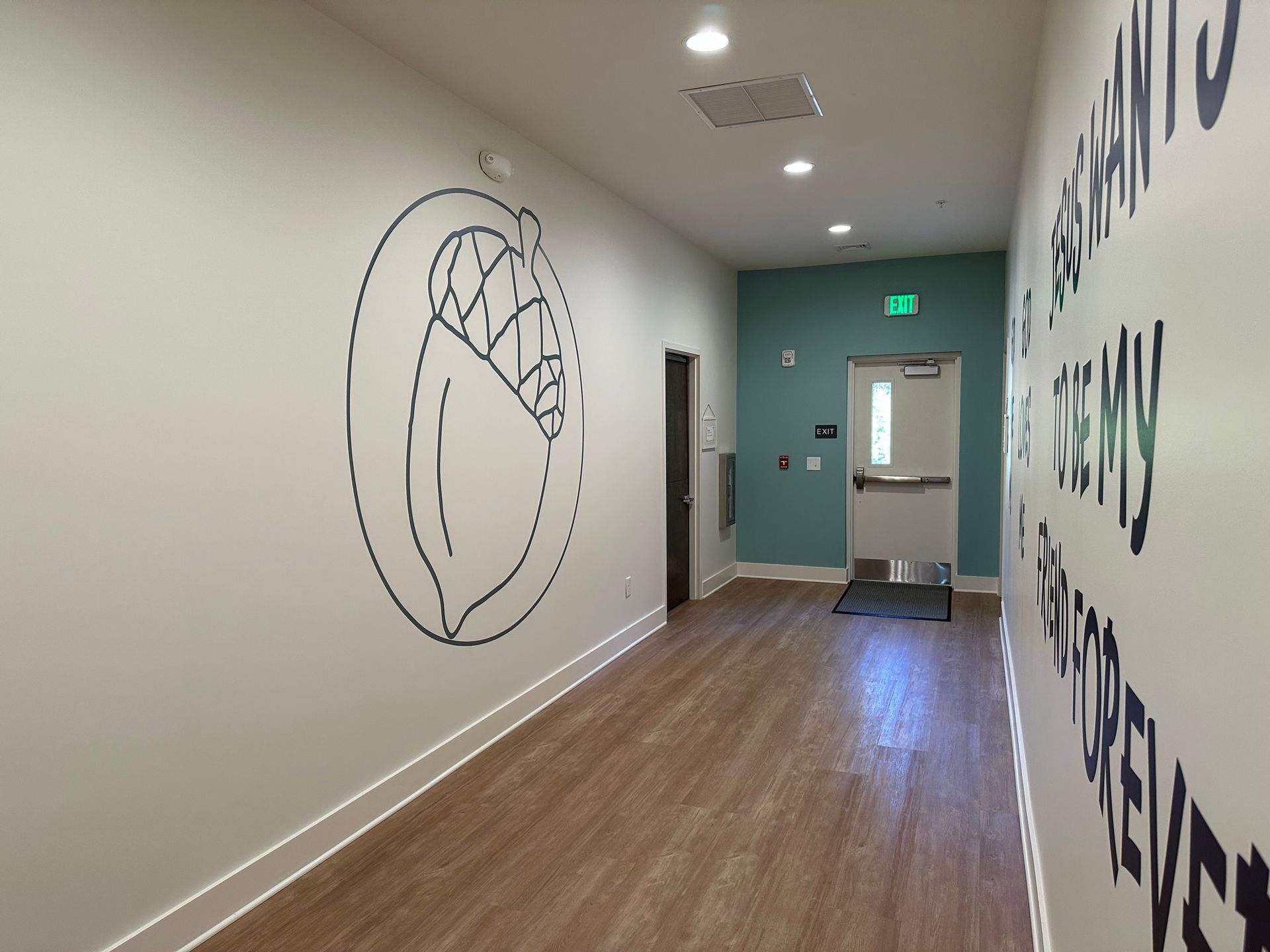 A hallway with a drawing of a heart on the wall