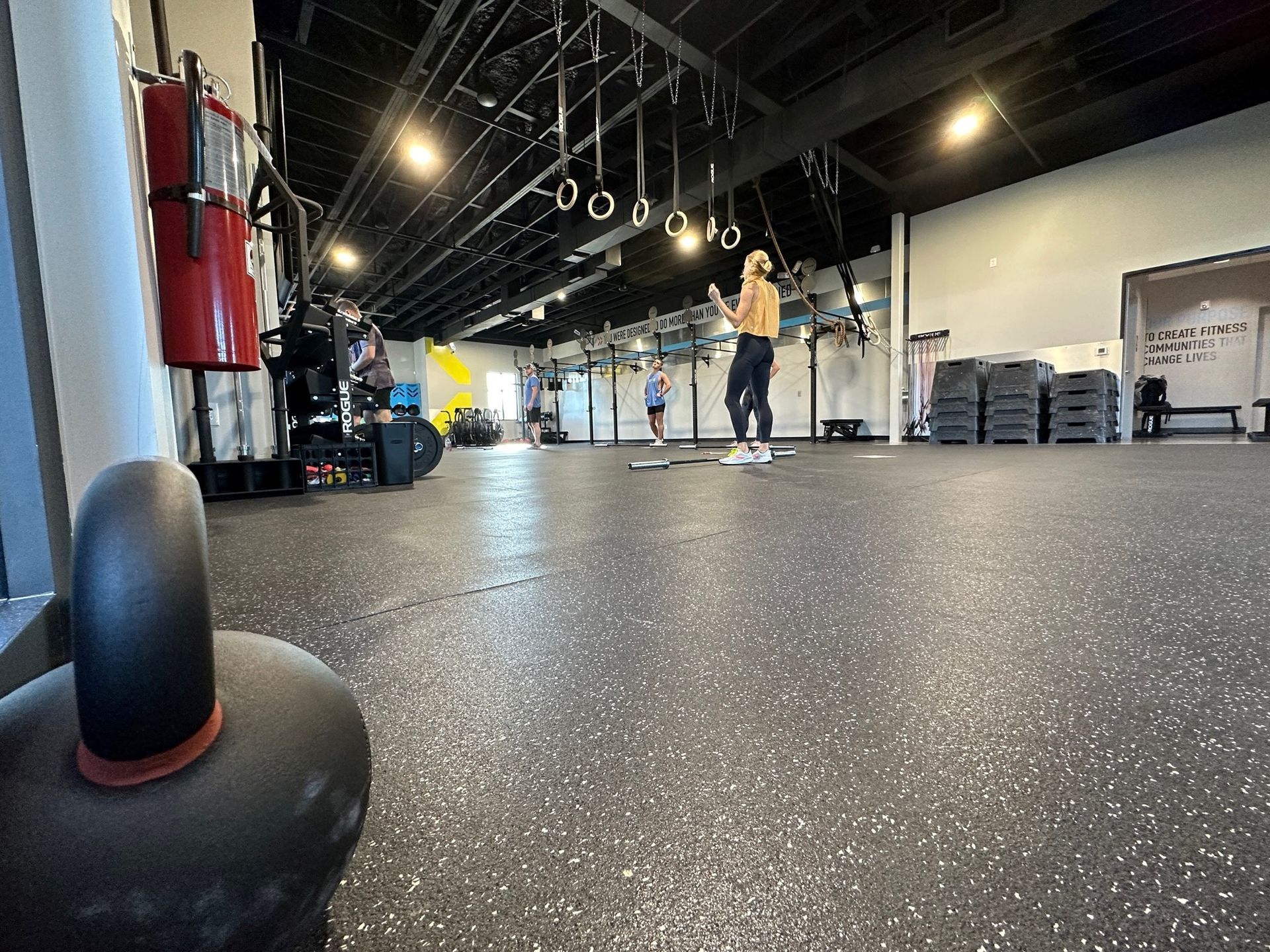 A group of people are working out in a gym.