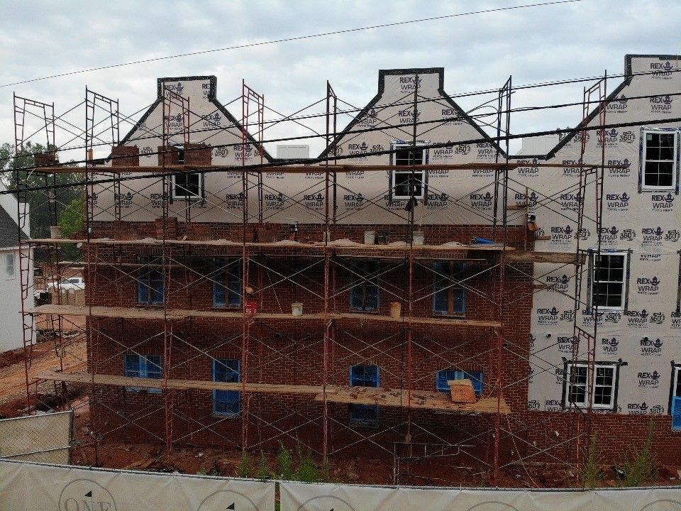 A building under construction with scaffolding around it