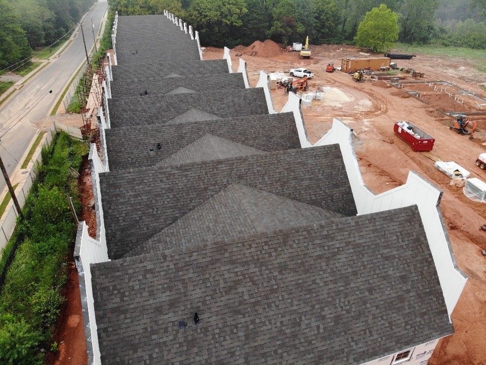 An aerial view of a row of houses under construction.