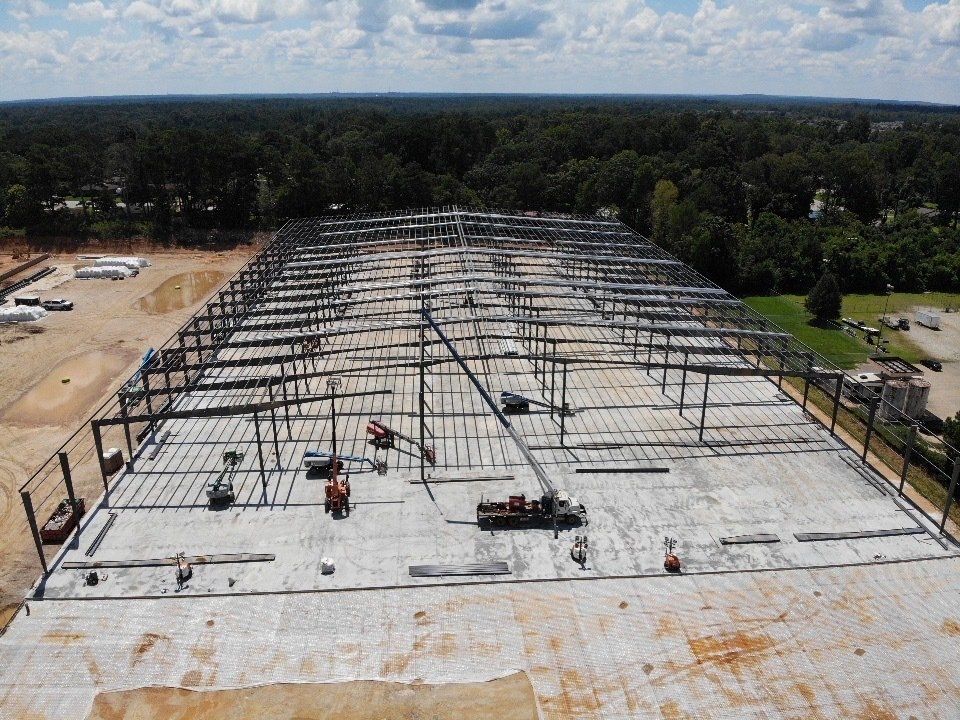 An aerial view of a large building under construction.