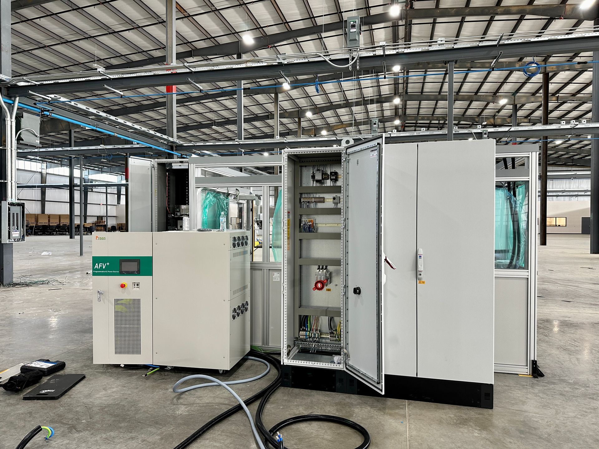 A large warehouse with a lot of electrical equipment in it.