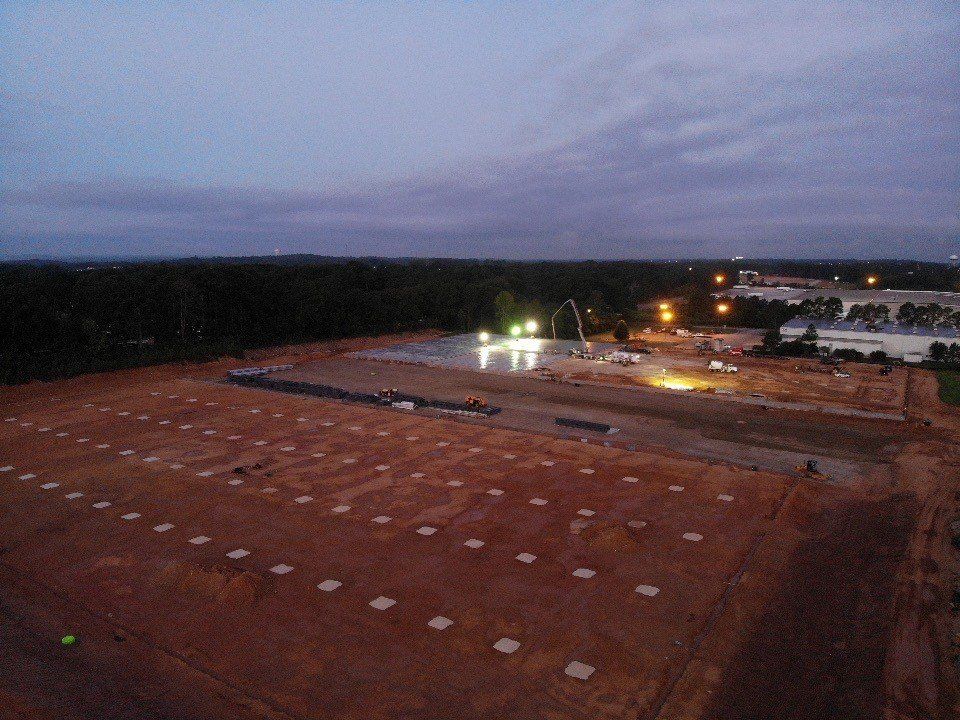 An aerial view of a construction site at night.