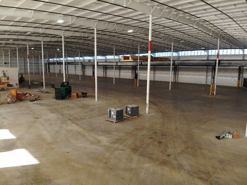 A large warehouse with a lot of empty space