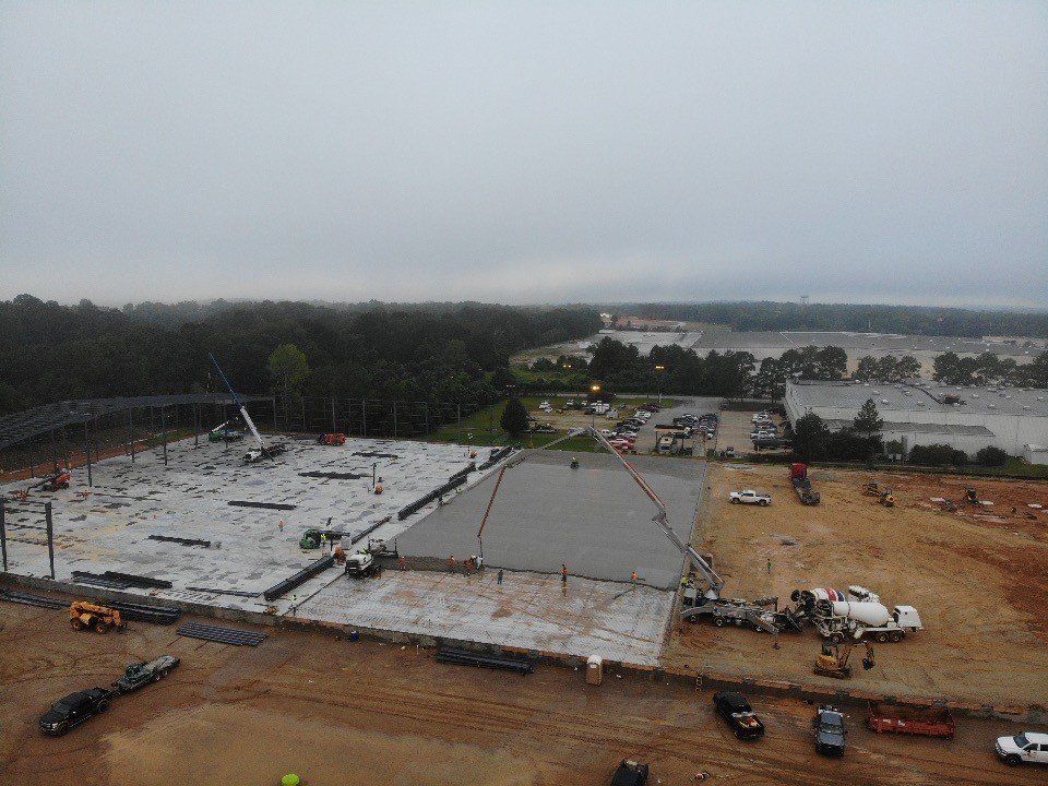 An aerial view of a large building under construction
