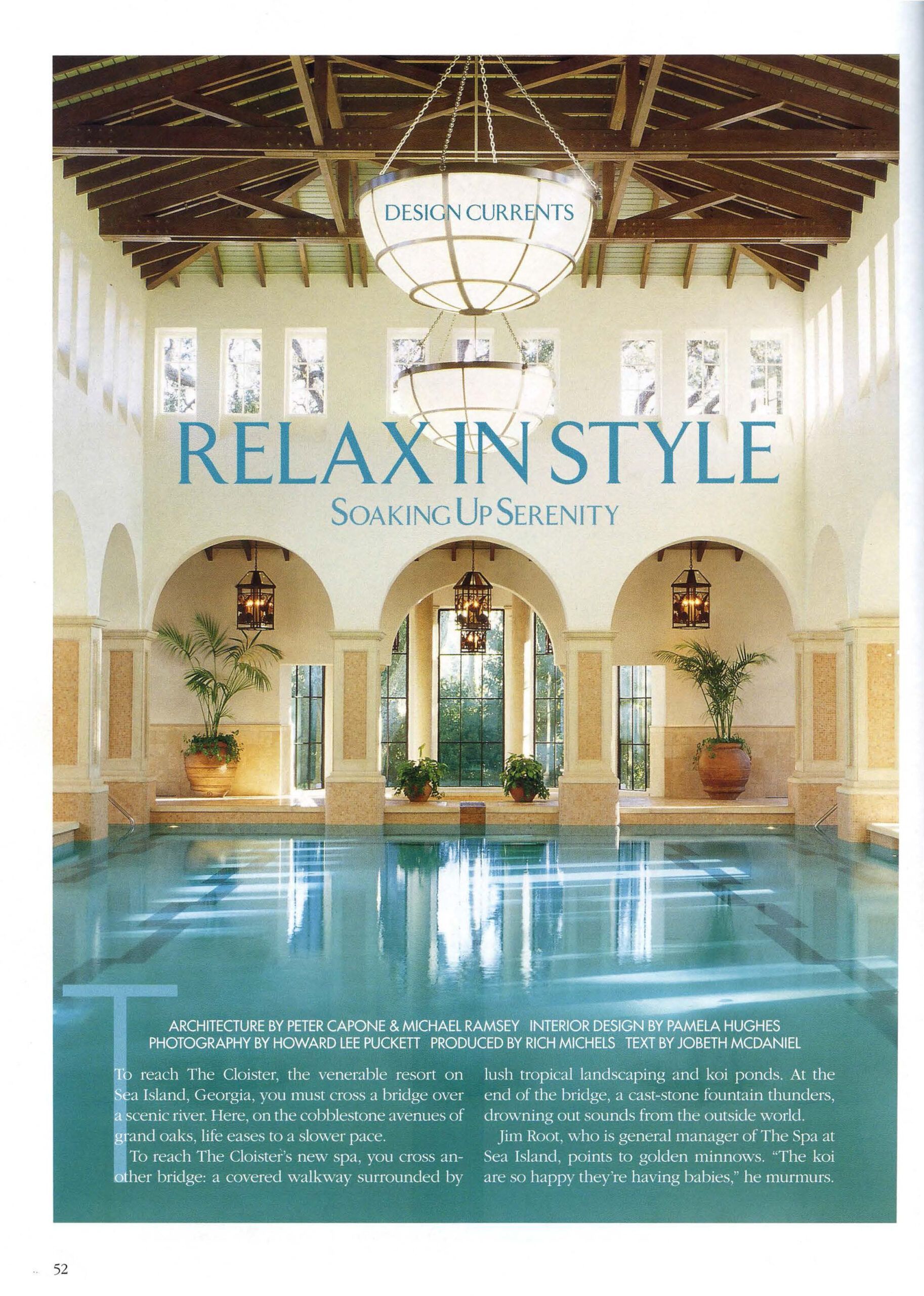 Indoor pool in a luxurious spa. Beige walls, high ceiling, arched doorways, and hanging lanterns.