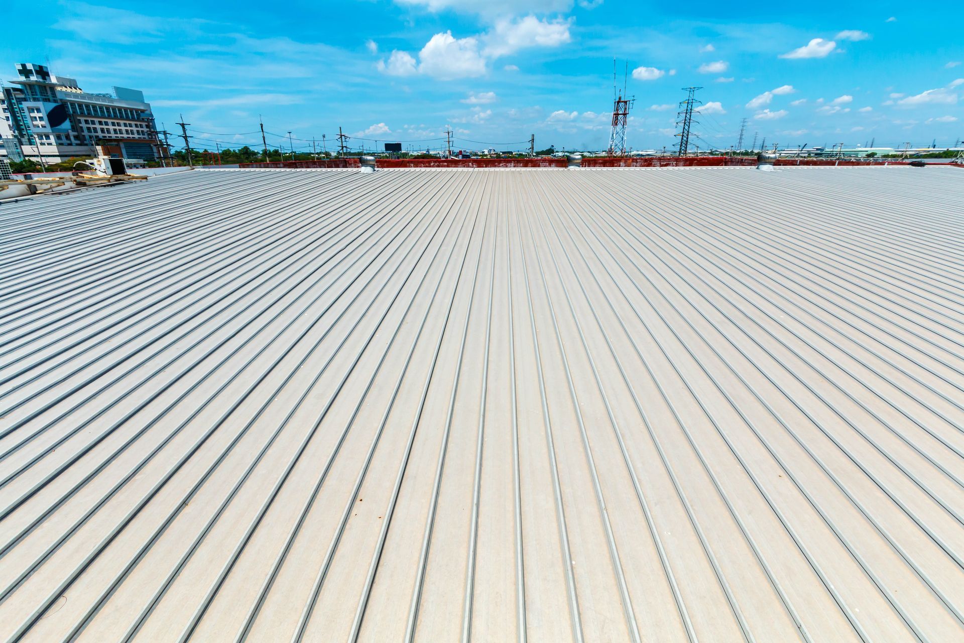 A wide-angle, high-angle shot of a flat roof featuring evenly spaced, parallel lines extending toward the horizon.