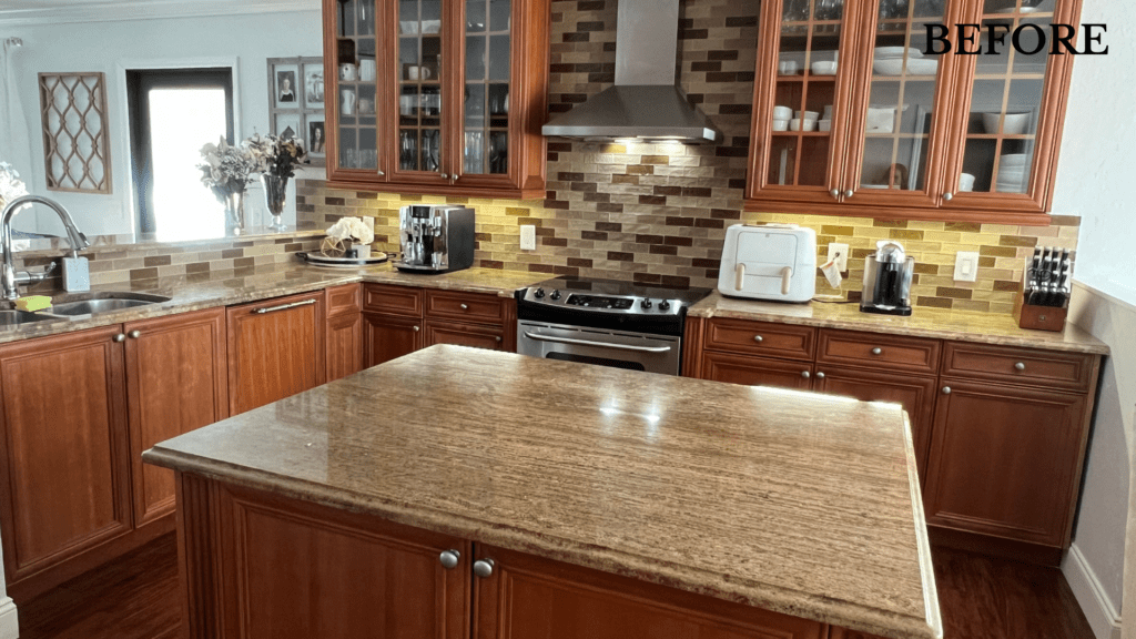 A kitchen with wooden cabinets and granite counter tops before being remodeled.