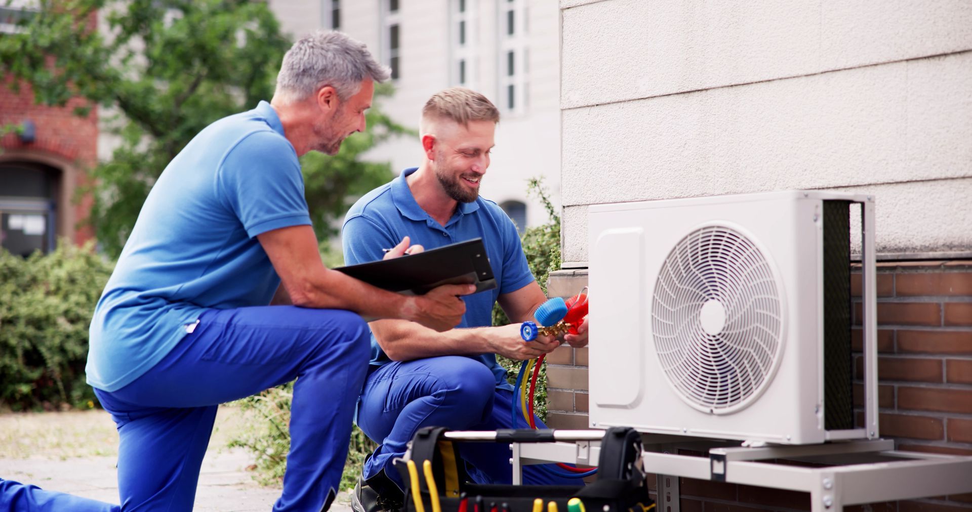 Elite HVAC technician servicing an air conditioning system