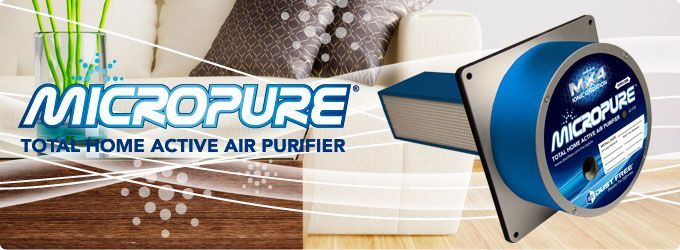 A micropure total home active air purifier is being used in a living room.