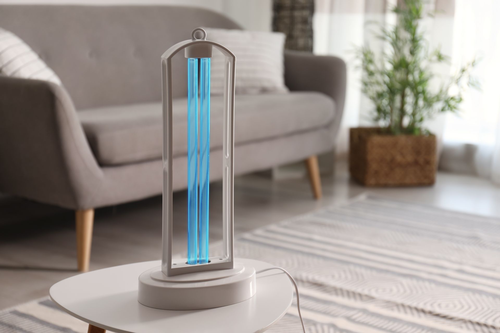 A uv light is sitting on a table in a living room.