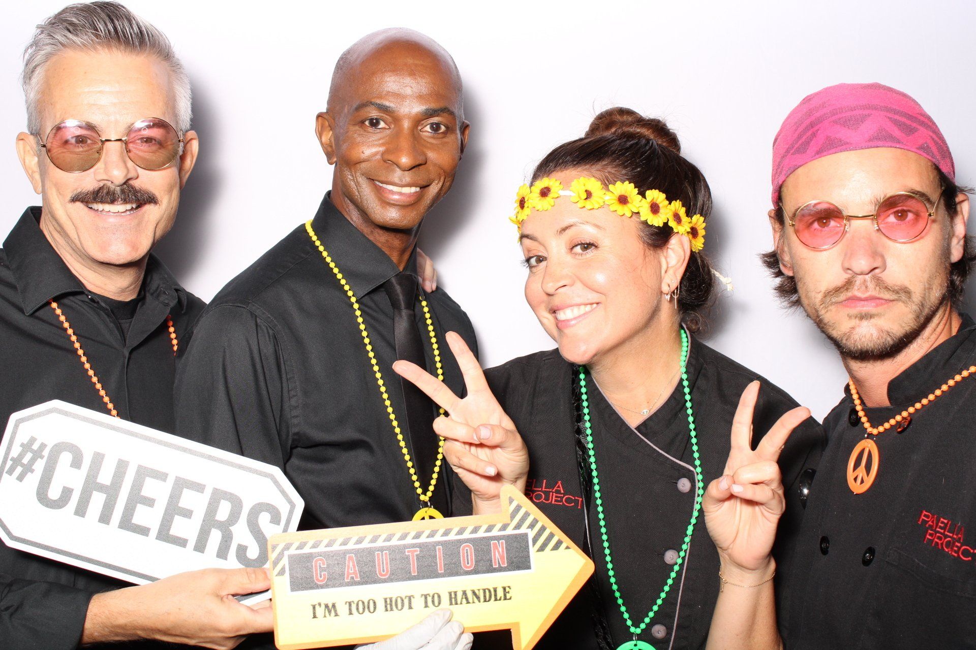 A group of people are posing for a picture in a photo booth.