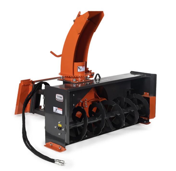 An orange and black hydraulic snow blower attachment with a large auger, isolated against a white background.