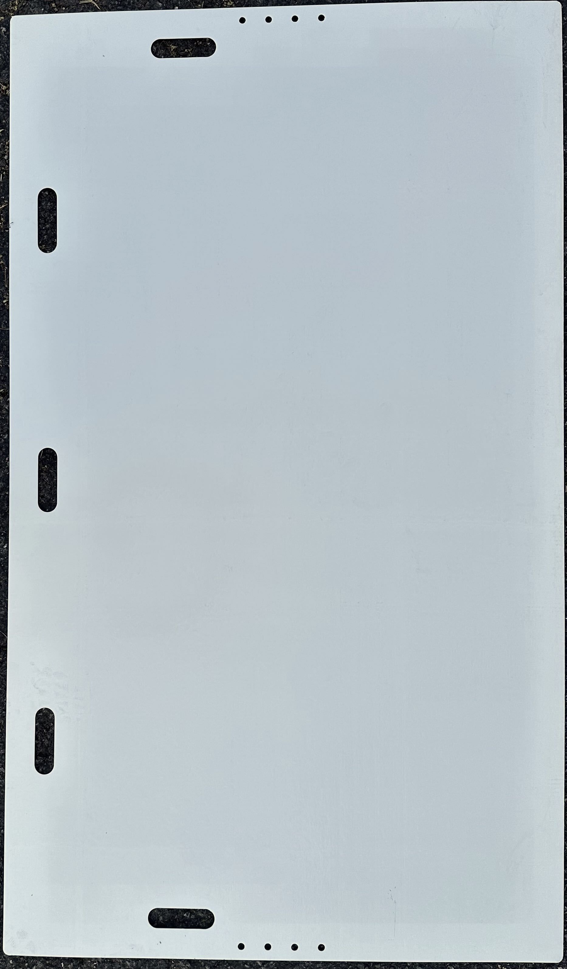 A white, rectangular piece of animation paper with four dark registration holes along the left side and top/bottom edges.