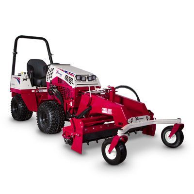A red and white Ventrac tractor with a front-mounted rake attachment against a white background.