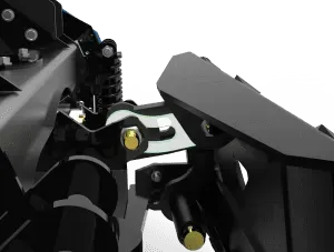 A close-up of a black industrial machinery joint with a silver, slotted metal plate secured by a gold bolt on a Kage Snowfire Blast.