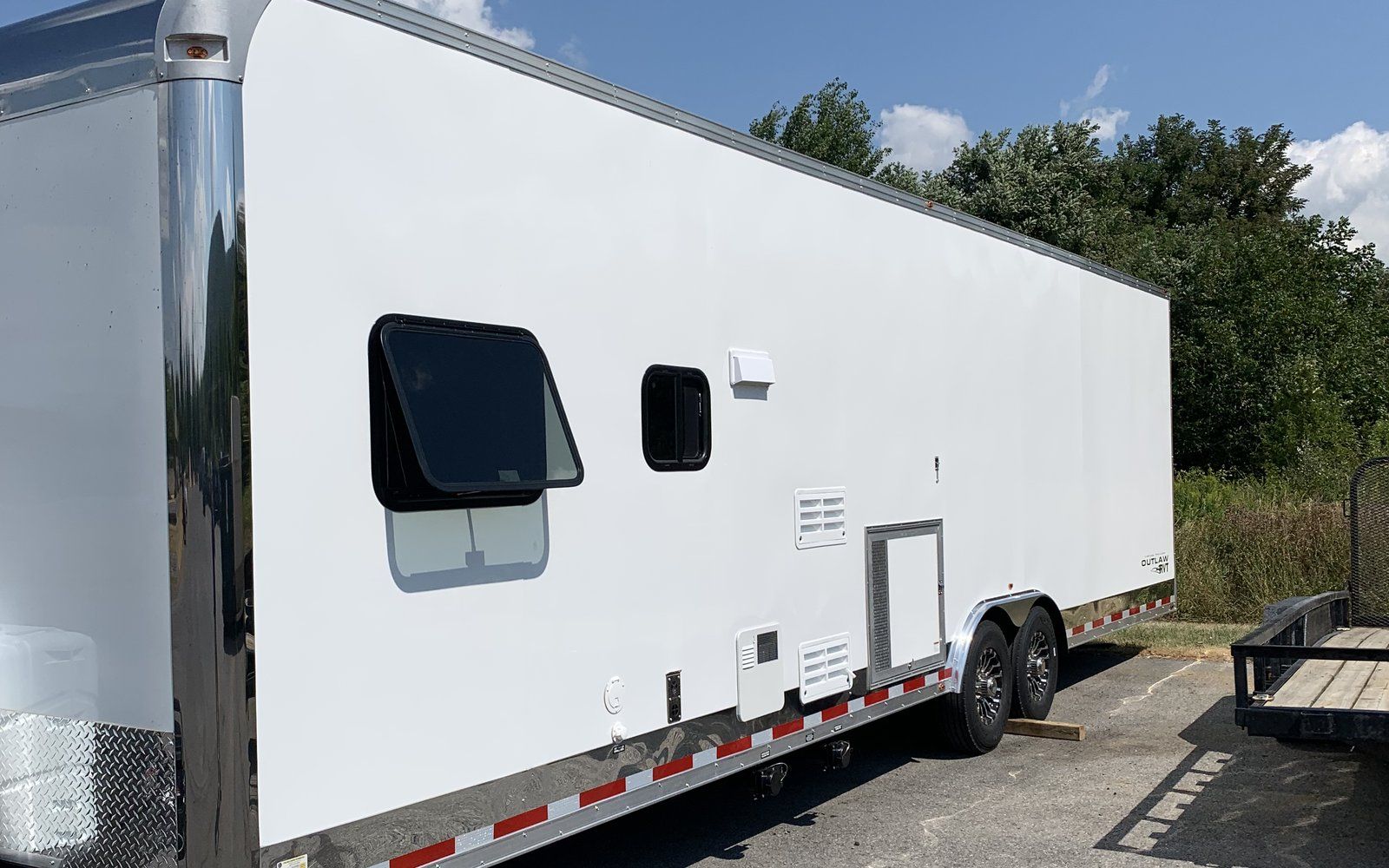 Vintage Trailers Outlaw RVT work trailer for rent, curb side, tandem axle