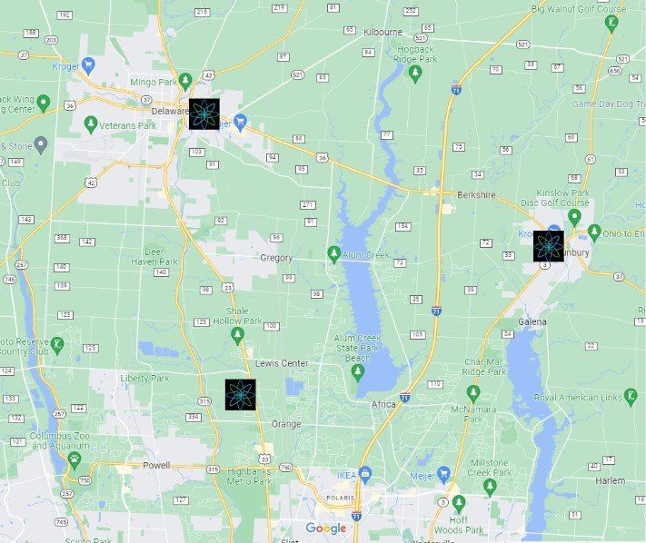 A digital map of an area featuring three square markers placed over towns, connected by road networks and local landmarks.