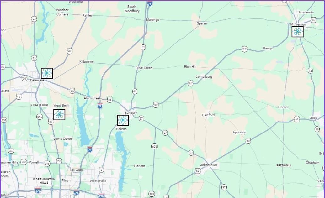 A digital map of an area featuring three square markers placed over towns, connected by road networks and local landmarks.