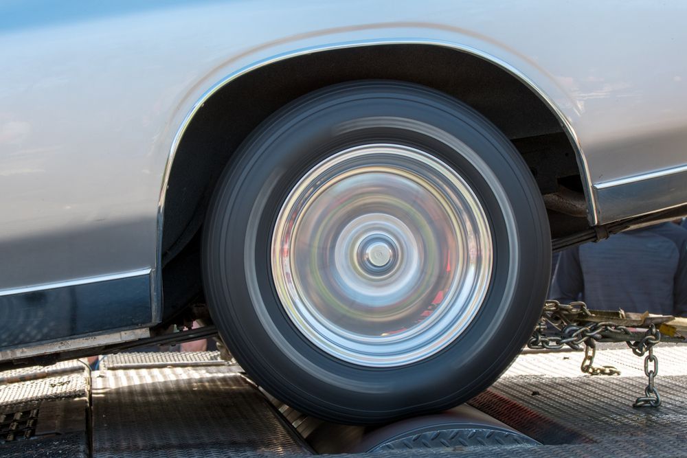 Silver Car Wheel Spinning on a Dyno Machine — EFI Evolutions Mechanical Repairs in Dubbo, NSW