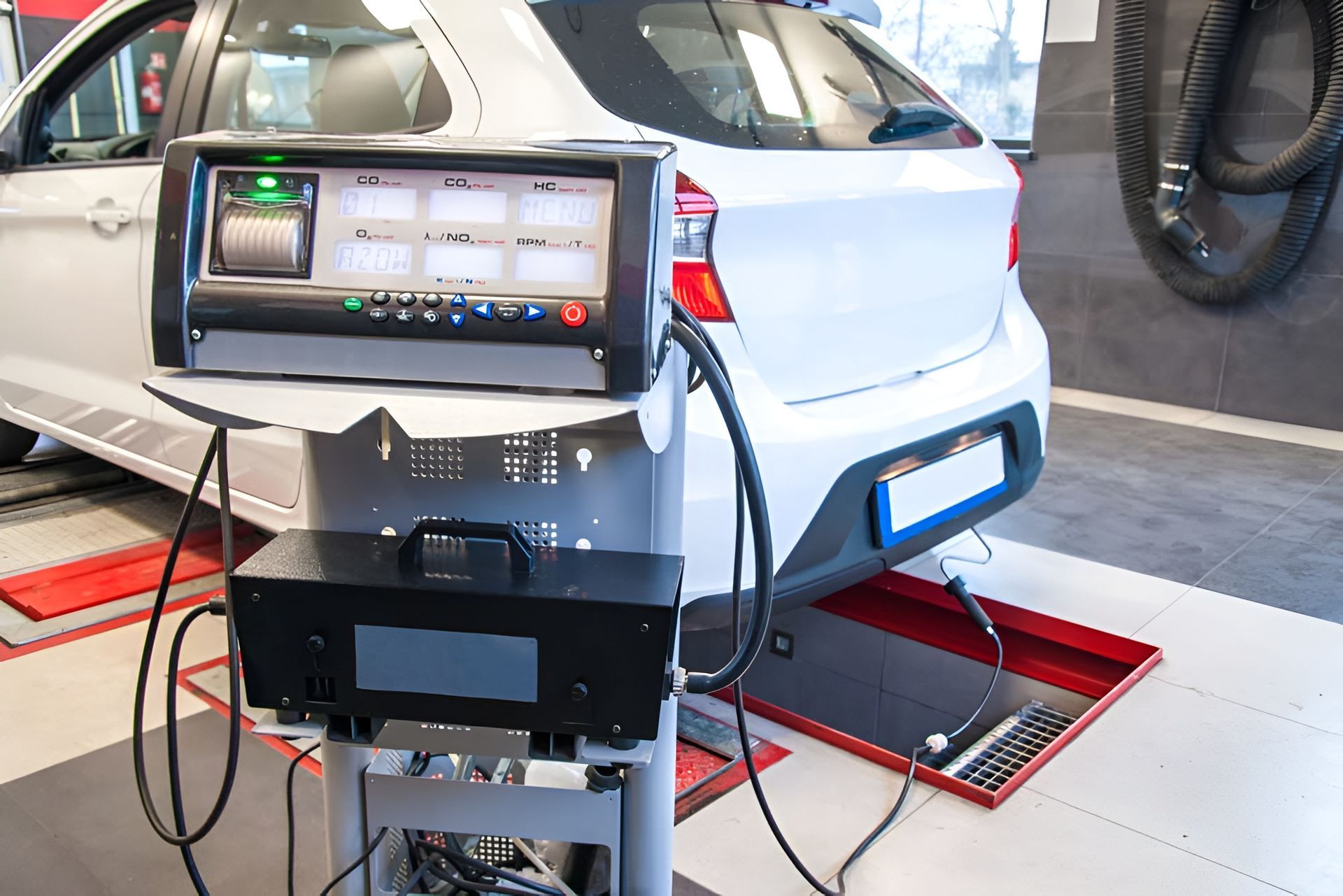 A White Car Undergoing an Emissions Test — EFI Evolutions Mechanical Repairs in Grafton, NSW