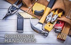 Maple Ridge Handyman picture of various tools lying on green grass forming the shape of a house.