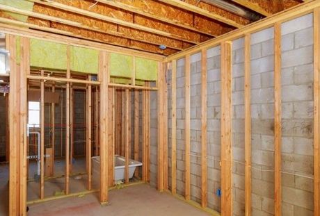 Richmond Handyman basement renovation picture of exposed wood structure framing.