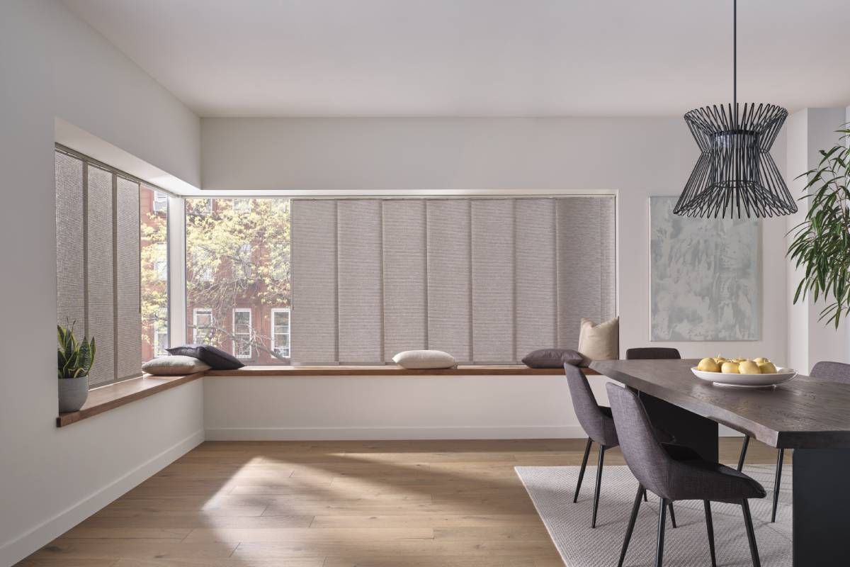 Hunter Douglas Skyline® Panel-Track Blinds as vertical blinds for town interiors in a modern dining room at Curtain Concepts near Huntington, WV