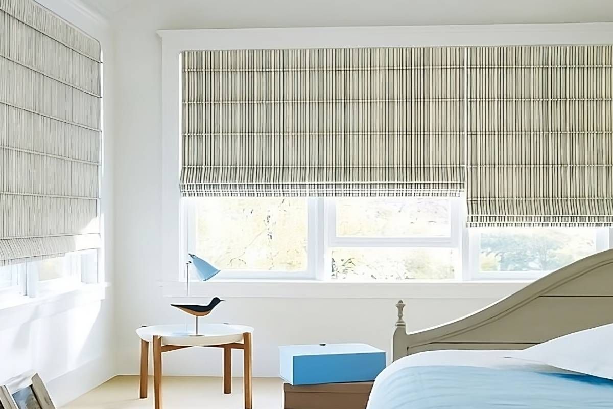 Hunter Douglas Alustra® Woven Textures® Roman Shades in a neutral color on large bedroom windows near Huntington, WV