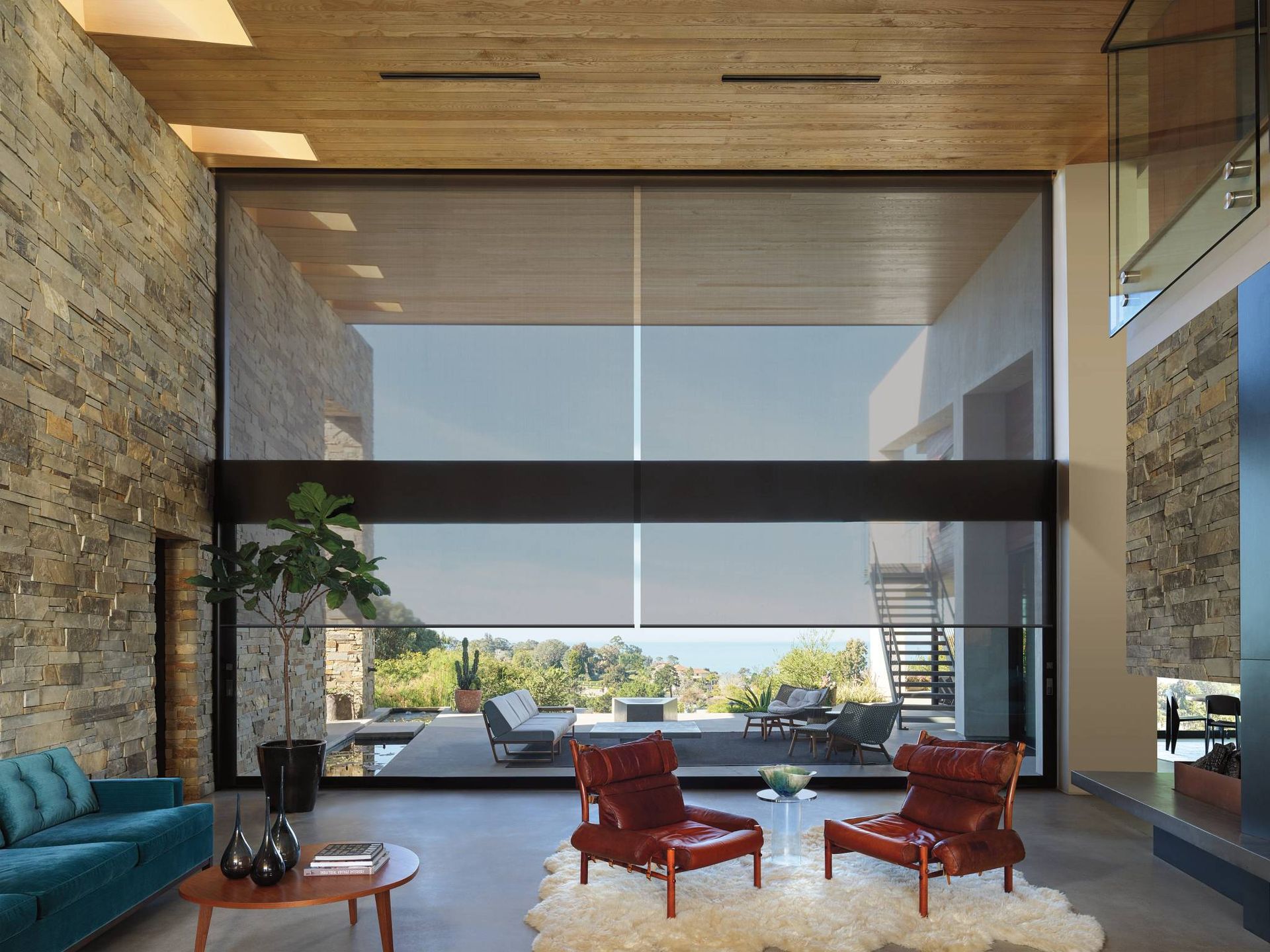 Gorgeous Hunter Douglas Designer Solar Shades on a large window in a living room