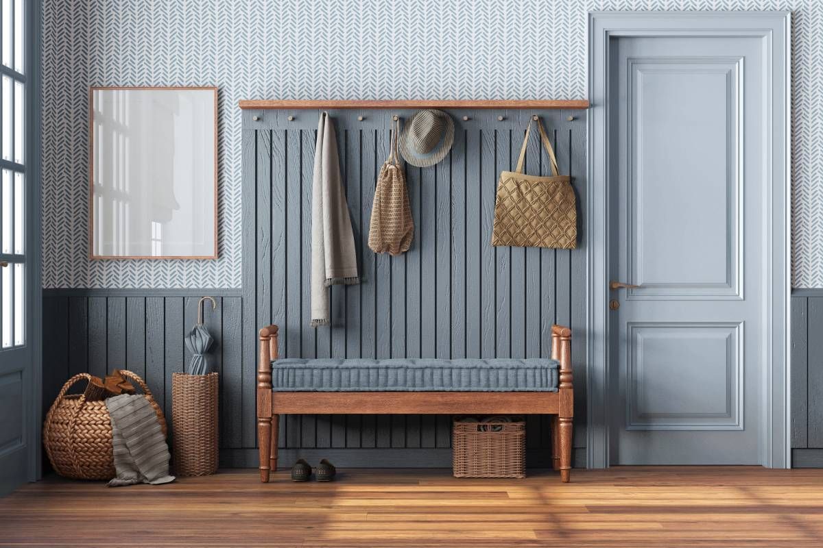 A coastal design entryway with wooden and rattan furniture at Curtain Concepts near Huntington, WV