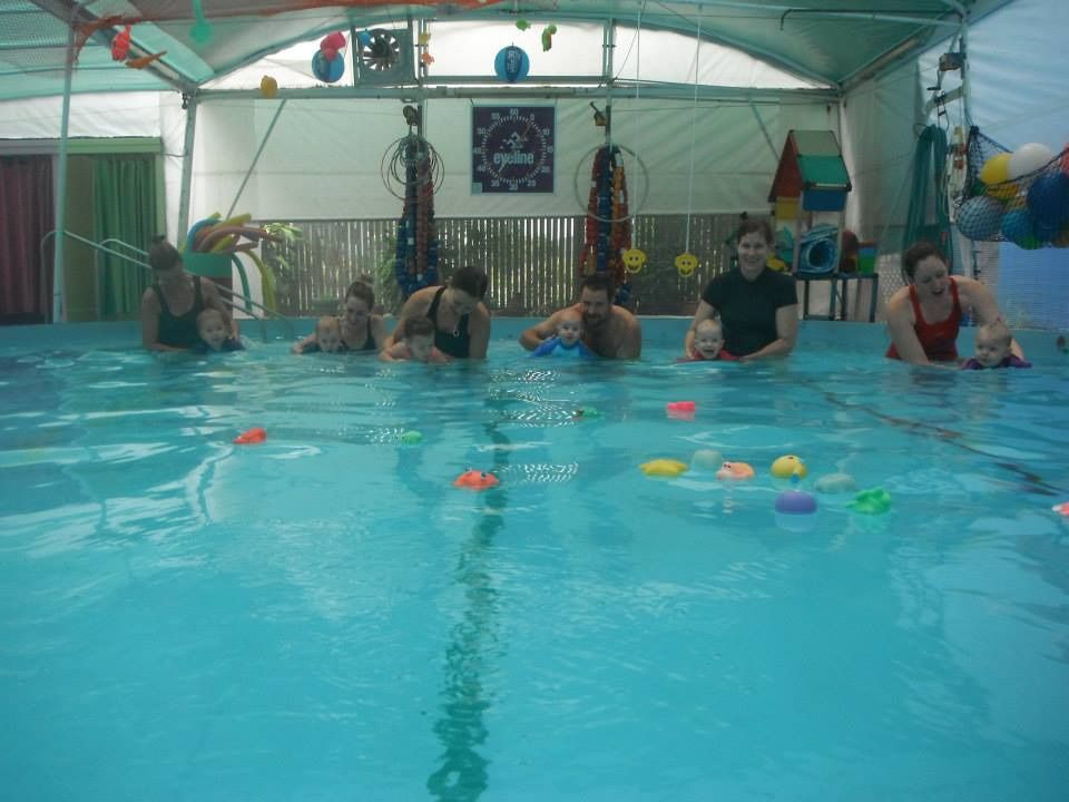 A Group of People Are Playing in a Swimming Pool — Affinity Swim in Norman Gardens, NSW